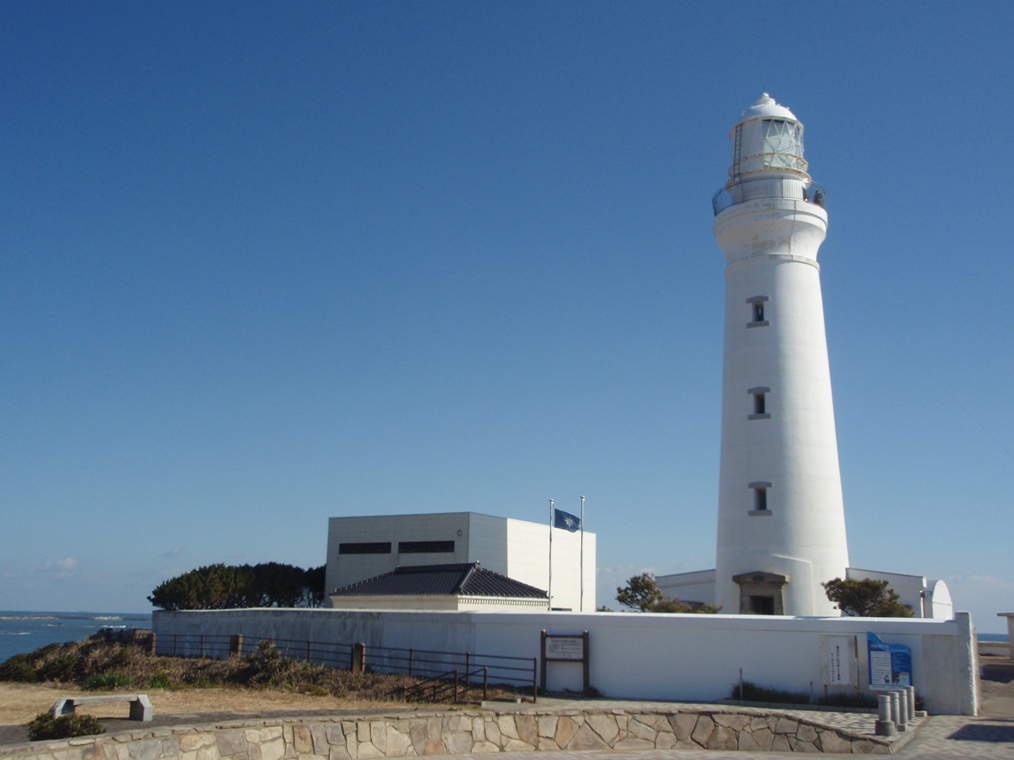 White brick Inubosaki Lighthouse rising above the headland.