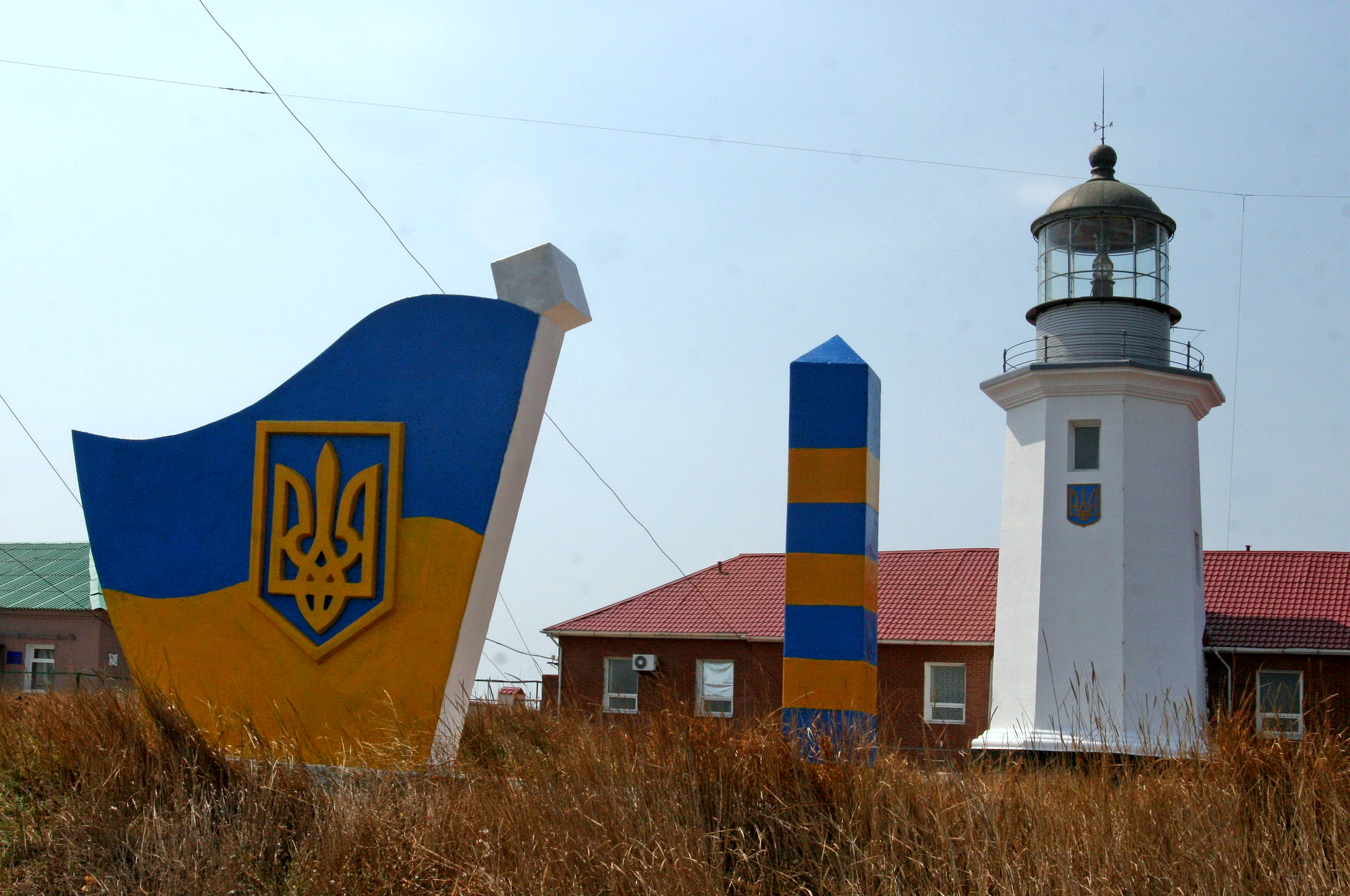 Zmiinyi Lighthouse before its destruction, standing above the Black Sea.